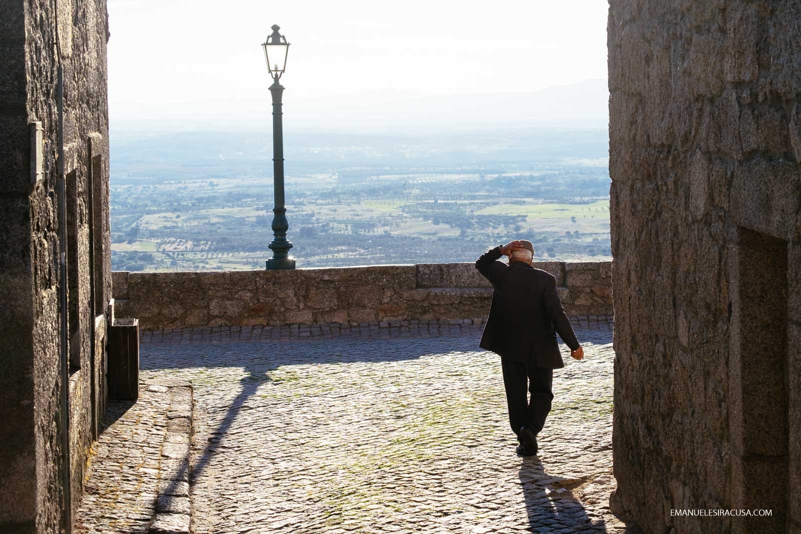 An elderly man walks towards a panoramic point in Monsanto, 2016